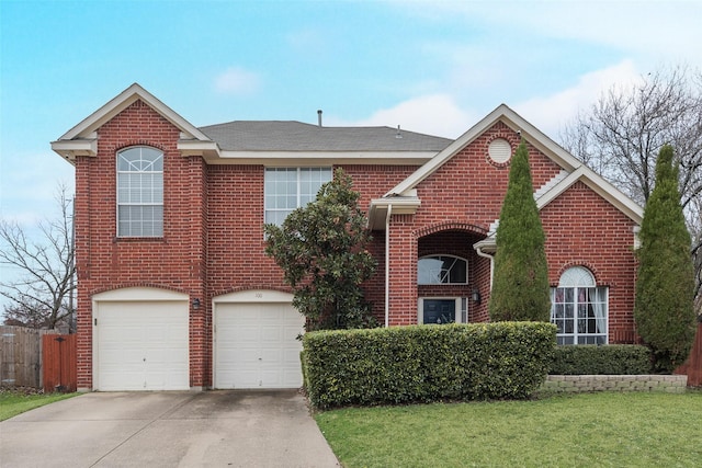 view of front property with a garage and a front lawn