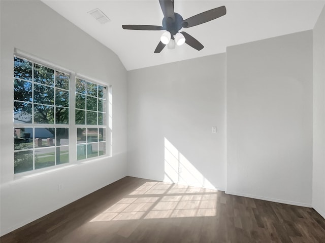 unfurnished room with ceiling fan, plenty of natural light, dark hardwood / wood-style flooring, and vaulted ceiling