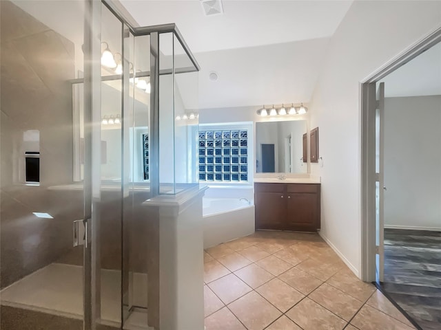 bathroom featuring vanity, separate shower and tub, and tile patterned flooring