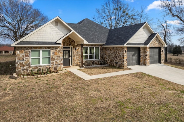 craftsman inspired home with a garage and a front lawn