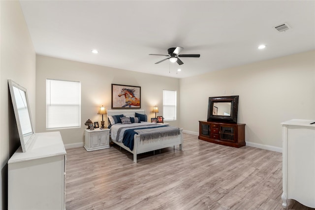 bedroom with ceiling fan and light wood-type flooring