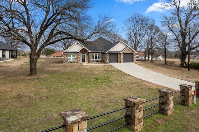 view of front facade featuring a garage and a front lawn