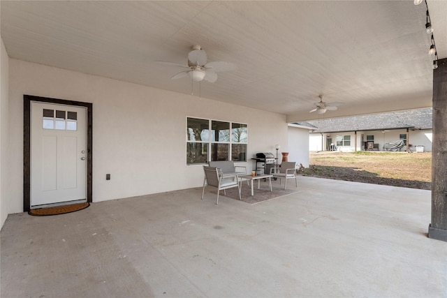 view of patio with a grill and ceiling fan