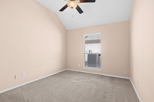 spare room with lofted ceiling, light carpet, ceiling fan, and baseboards