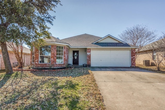 ranch-style house with a garage and central AC