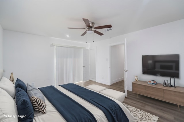 bedroom with hardwood / wood-style flooring and ceiling fan