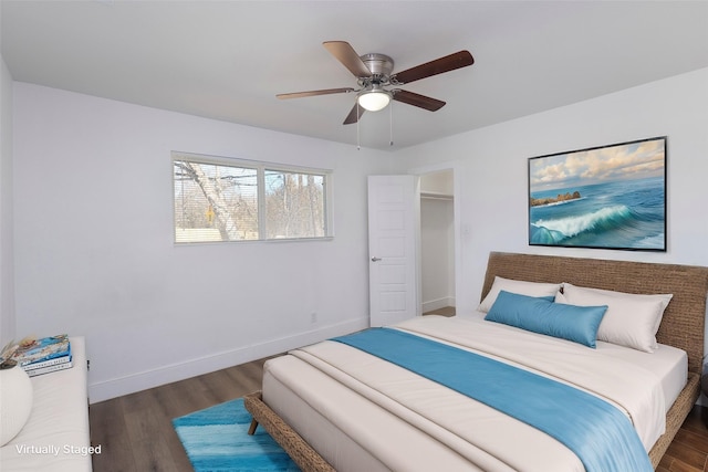 bedroom with ceiling fan and dark hardwood / wood-style flooring