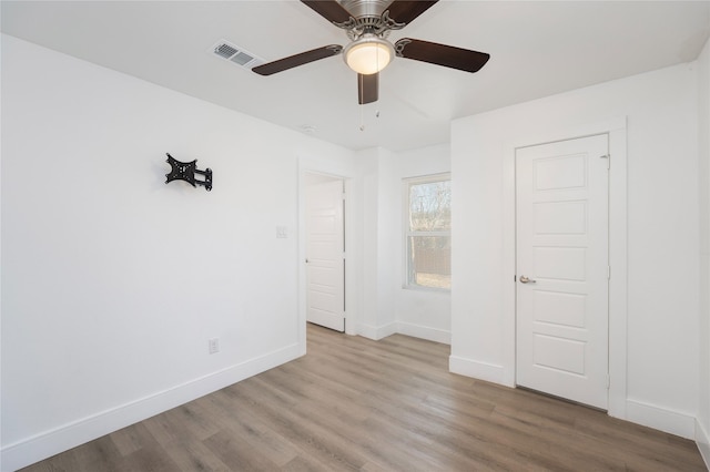 unfurnished bedroom featuring light hardwood / wood-style floors and ceiling fan