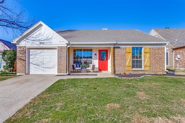 single story home featuring a garage and a front yard