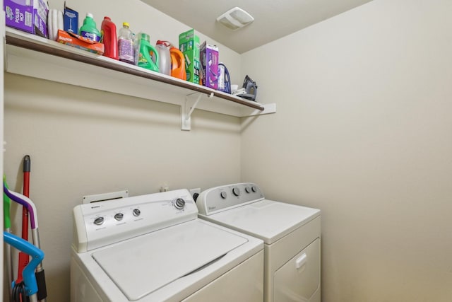 washroom featuring washing machine and dryer