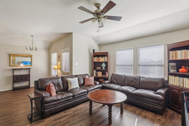 living room with a healthy amount of sunlight, lofted ceiling, and dark hardwood / wood-style floors