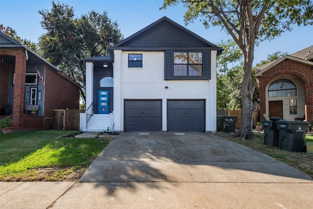 view of front of home featuring a garage and a front yard