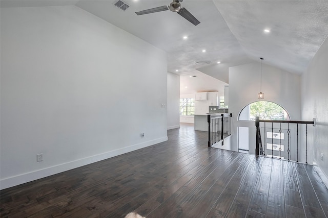 unfurnished room featuring high vaulted ceiling, dark hardwood / wood-style floors, and ceiling fan