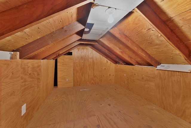 additional living space featuring vaulted ceiling