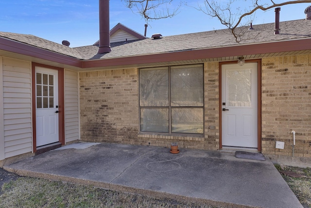 property entrance featuring a patio area