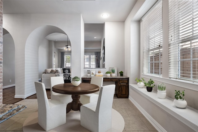 dining area featuring light tile patterned flooring and ceiling fan