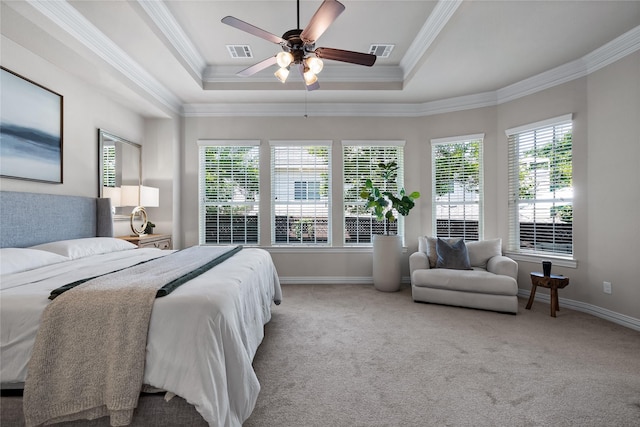 bedroom with multiple windows, crown molding, and light colored carpet