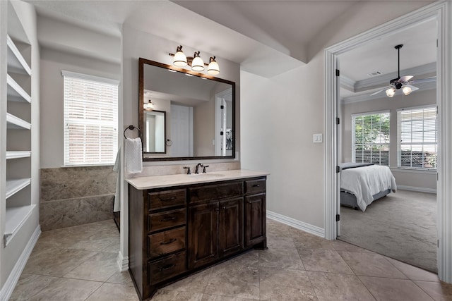 bathroom with vanity, tile patterned flooring, ornamental molding, and ceiling fan