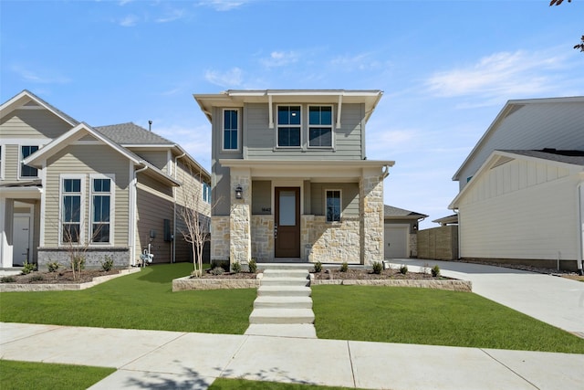 view of front of property featuring a front lawn and concrete driveway