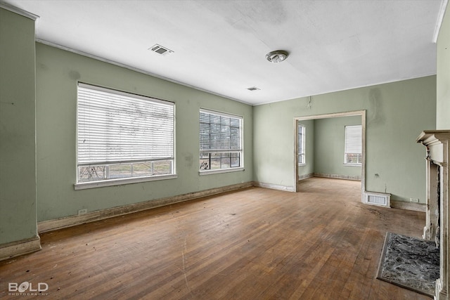 unfurnished living room featuring hardwood / wood-style flooring