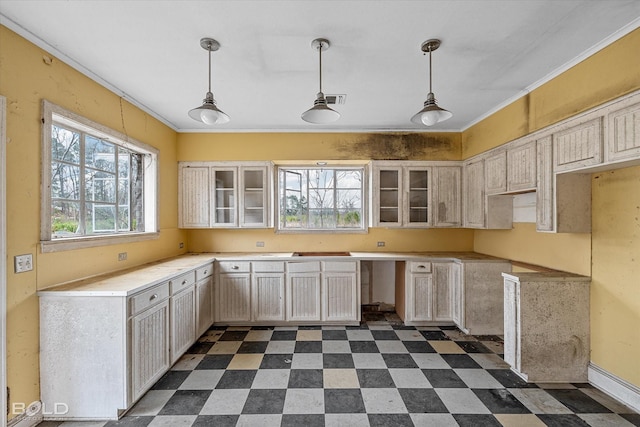 kitchen featuring decorative light fixtures and ornamental molding