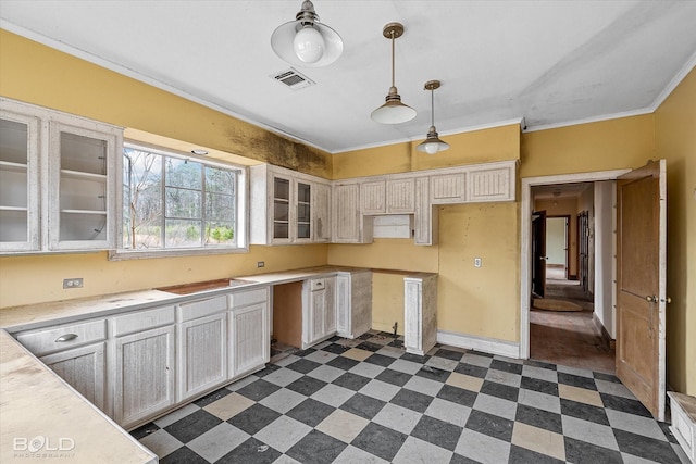 kitchen featuring hanging light fixtures and ornamental molding