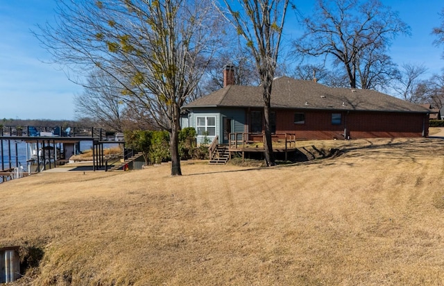 view of yard featuring a deck with water view