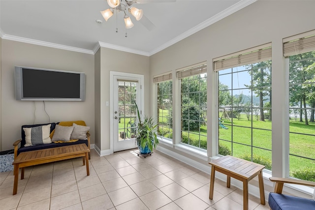 sunroom featuring ceiling fan