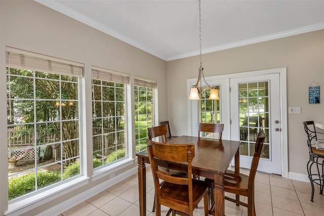 tiled dining room with crown molding and plenty of natural light