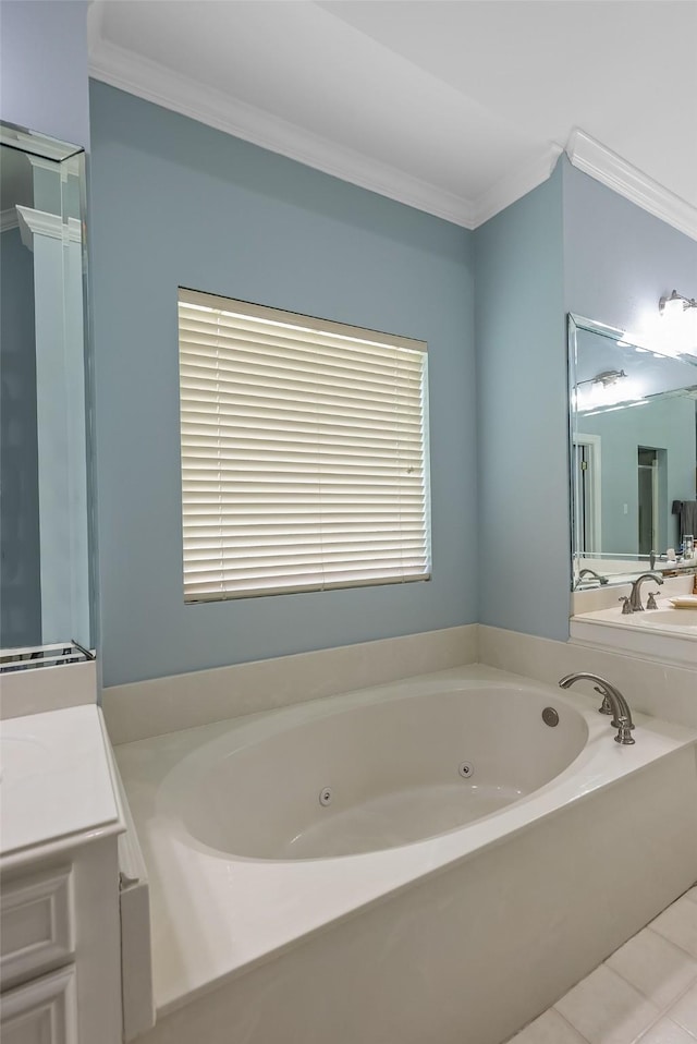 bathroom with crown molding, vanity, tile patterned floors, and a tub to relax in