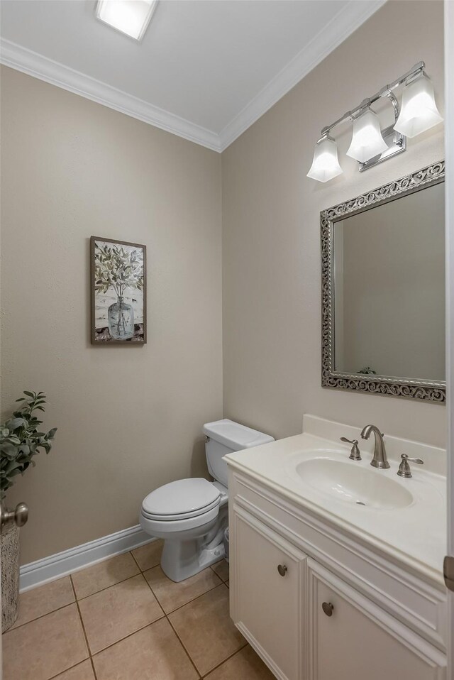 bathroom featuring crown molding, vanity, toilet, and tile patterned flooring