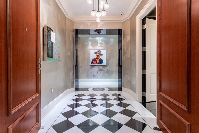 hall featuring crown molding and a notable chandelier