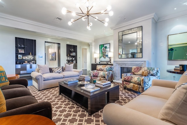 living room featuring ornamental molding, decorative columns, a premium fireplace, and carpet flooring