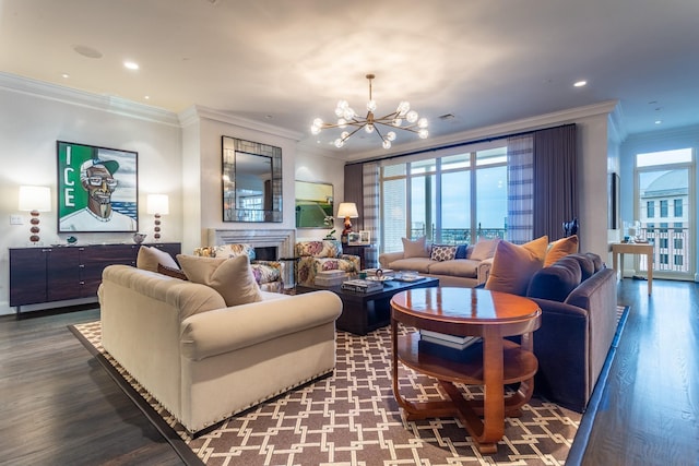 living room featuring wood-type flooring, ornamental molding, and an inviting chandelier