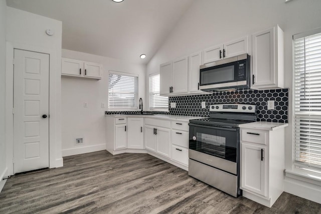 kitchen with stainless steel appliances and white cabinetry