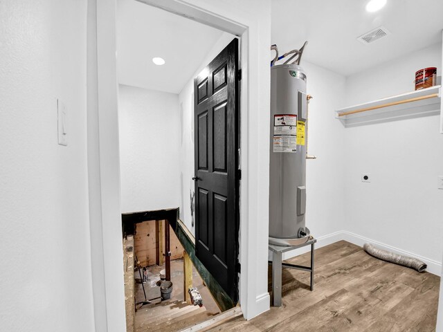 interior space featuring ceiling fan, plenty of natural light, and light wood-type flooring