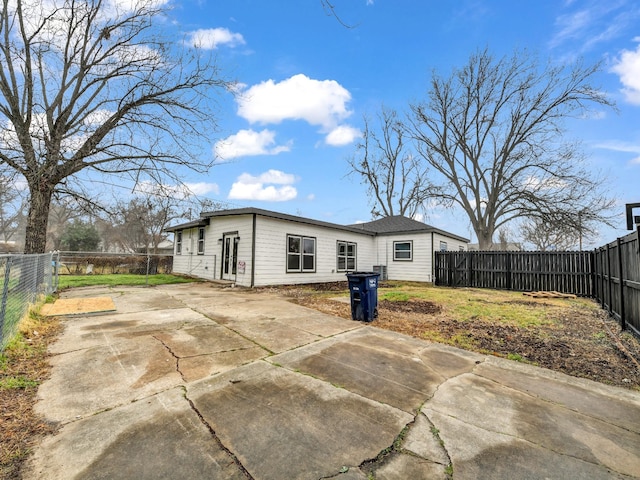 rear view of property featuring a patio area