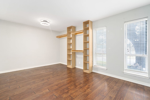 spare room with dark hardwood / wood-style floors