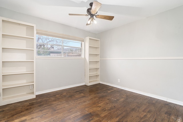 spare room with ceiling fan and dark hardwood / wood-style flooring