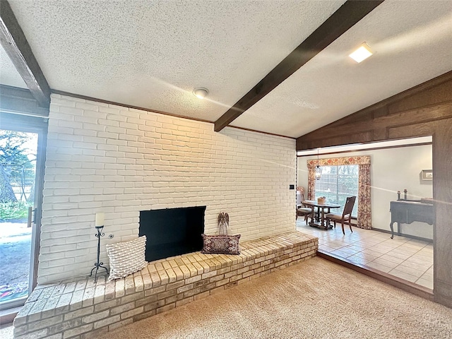 living room featuring brick wall, a fireplace, lofted ceiling with beams, and a textured ceiling