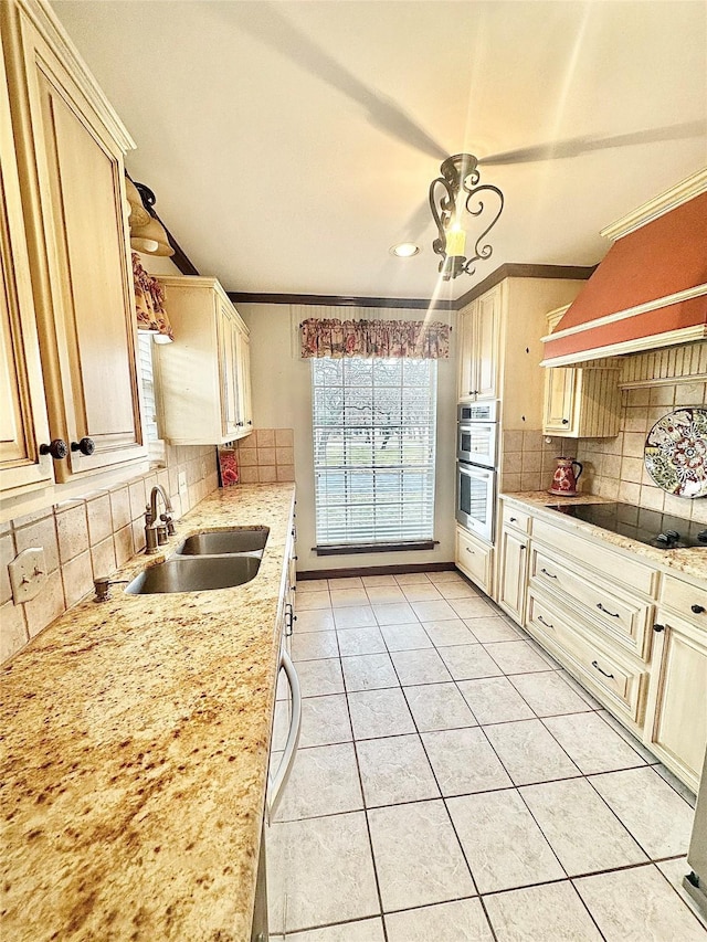 kitchen with double oven, black electric stovetop, light tile patterned flooring, a sink, and custom exhaust hood