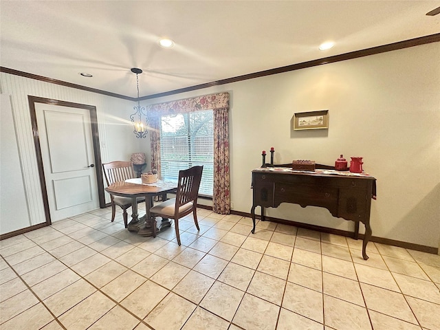 dining space with light tile patterned floors, ornamental molding, a notable chandelier, and baseboards