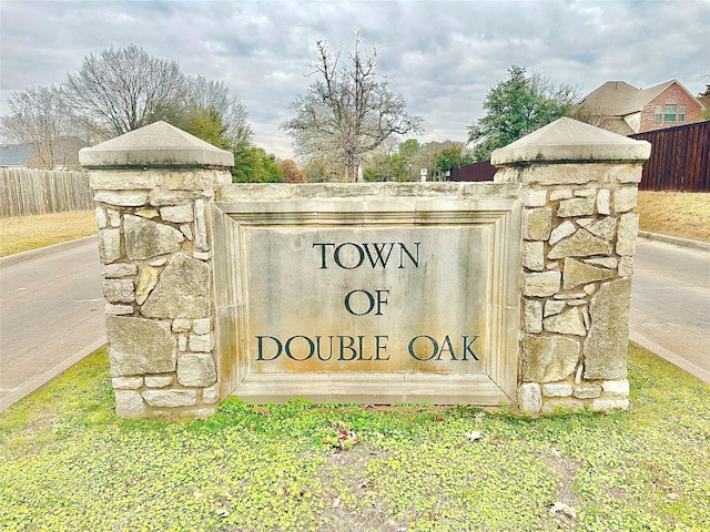 community sign with fence