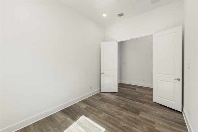 7221 Ladybug, Little Elm, TX 76227 - unfurnished bedroom featuring baseboards, wood finished floors, and recessed lighting