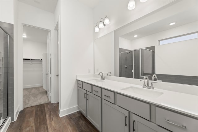 7221 Ladybug, Little Elm, TX 76227 - full bath with a stall shower, a walk in closet, wood finished floors, double vanity, and recessed lighting