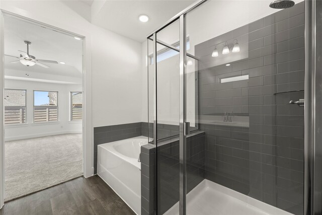 7221 Ladybug, Little Elm, TX 76227 - bathroom with wood finished floors, ceiling fan, a garden tub, a stall shower, and recessed lighting