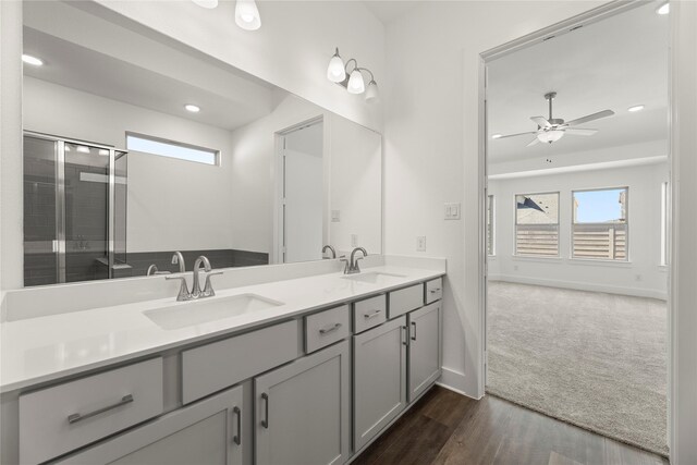 7221 Ladybug, Little Elm, TX 76227 - bathroom featuring plenty of natural light, ceiling fan, wood finished floors, double vanity, and recessed lighting