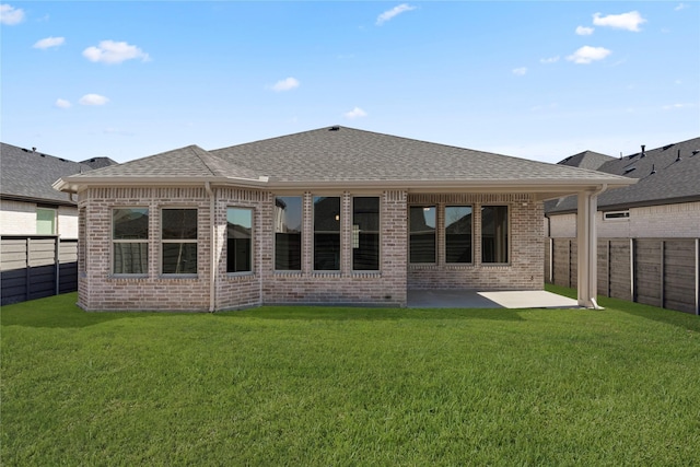 7221 Ladybug, Little Elm, TX 76227 - back of house featuring a patio, brick siding, and roof with shingles
