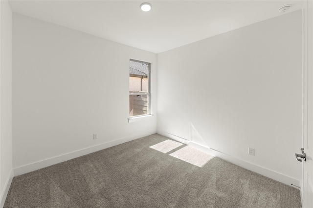 7221 Ladybug, Little Elm, TX 76227 - carpeted spare room with baseboards, a smoke detector, and recessed lighting