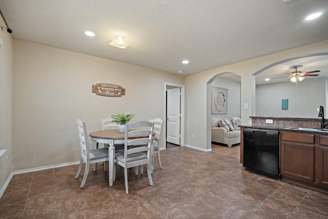 dining room with sink and ceiling fan